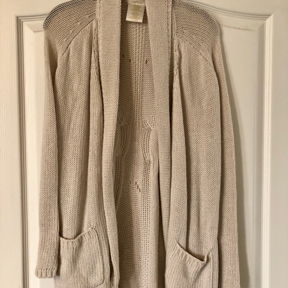 Tan colored knit cardigan.